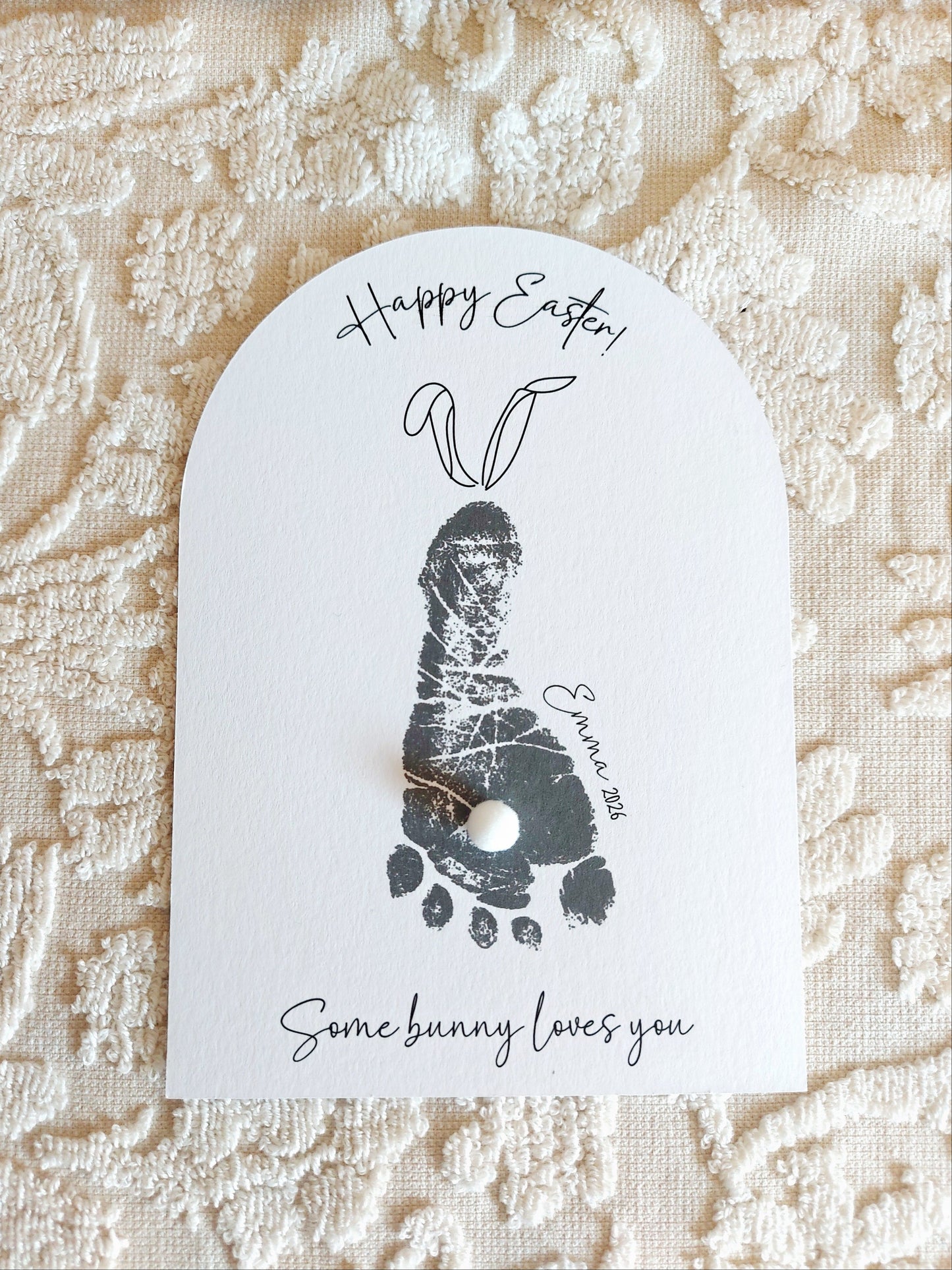 Easter Card keepsake with a baby footprint and text on a textured fabric background