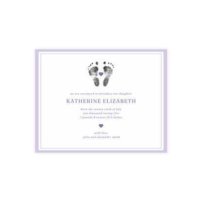 Newborn baby announcement card with footprints and text on a white background