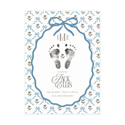 Birth announcement with footprints, blue decorative frame, and floral elements on a white background.