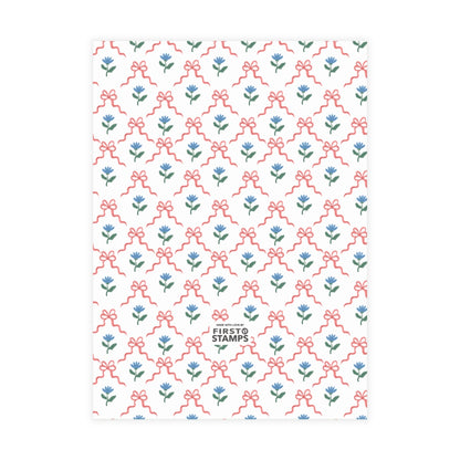Red & blue patterned paper with floral and bow design on a white background. First Stamps logo at bottom.