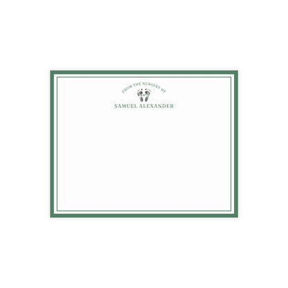 White card with baby footprints, green border and text on a white background