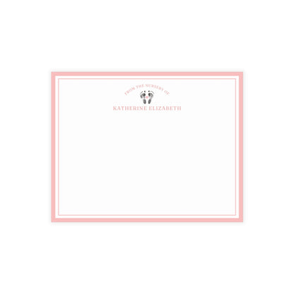 White card with baby footprints, pink border and text on a white background