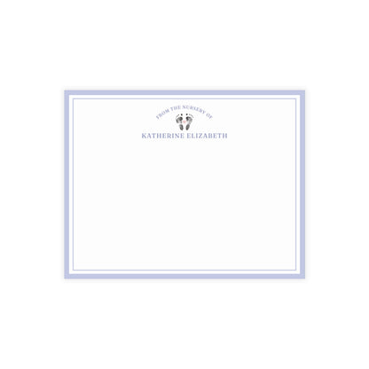 White card with baby footprints, purple border and text on a white background
