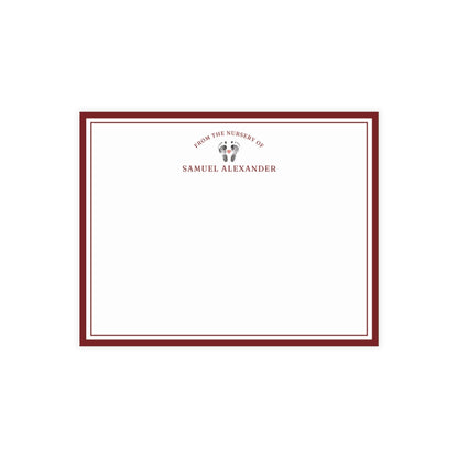 White card with baby footprints, red border and text on a white background