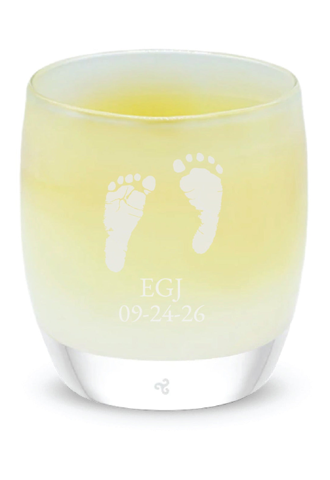 Glassybaby candle with footprints on a white background