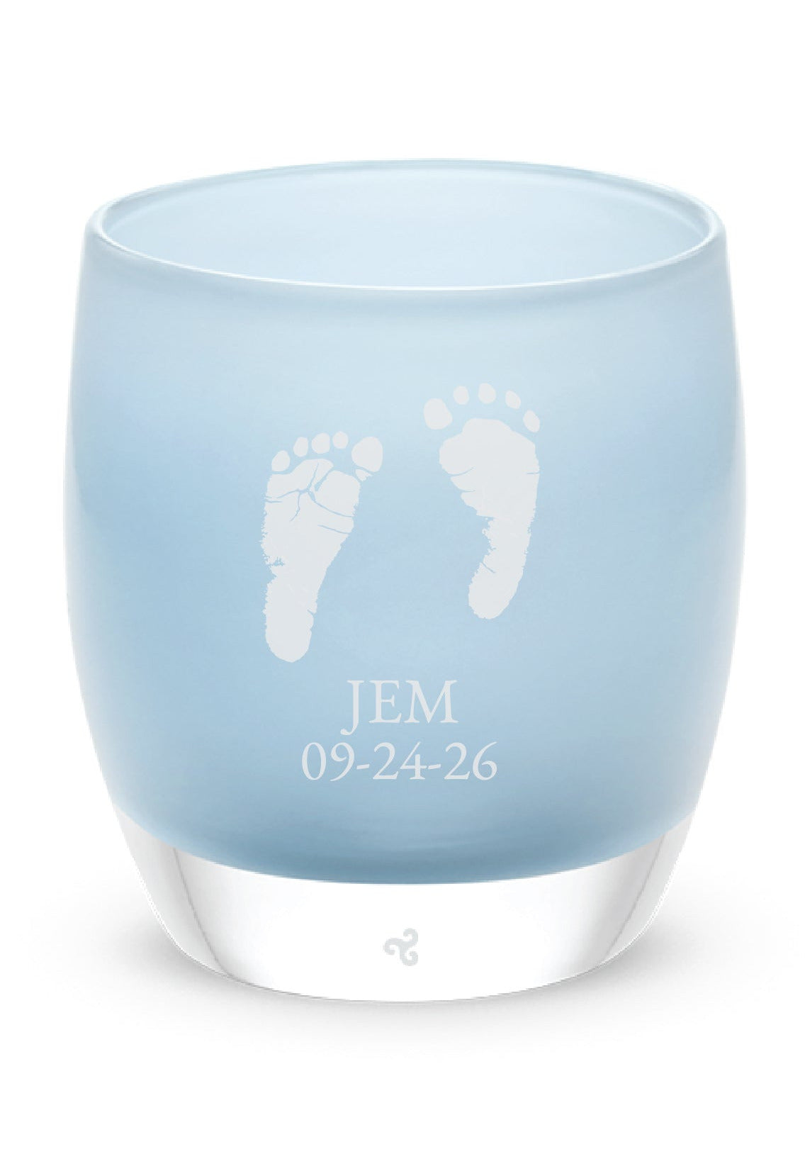 Glassybaby tea light holder with engraved baby feet and name on a white background