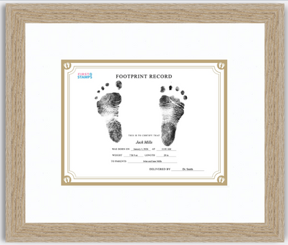 Framed baby footprint record with black and white footprints on a white background