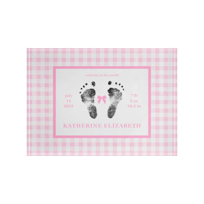 Pink acrylic block with  baby footprints and text.