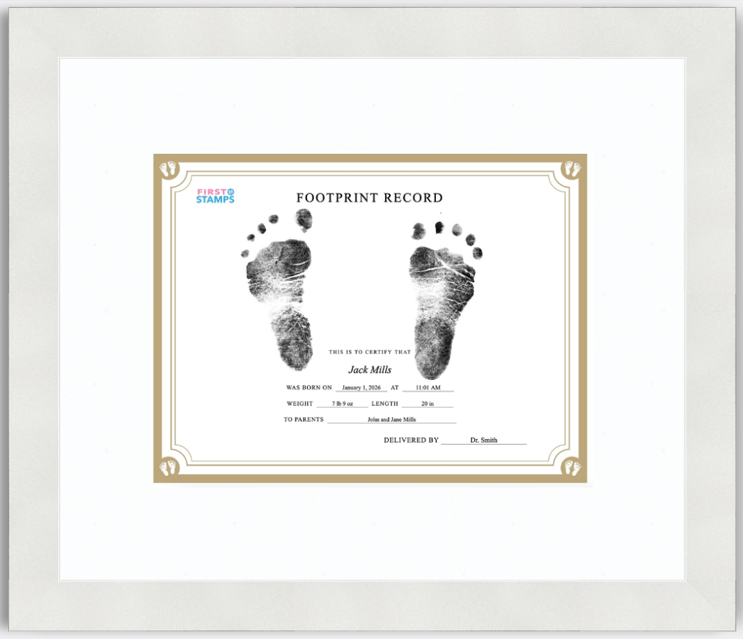 Framed baby footprint record with black and white footprints on a white background